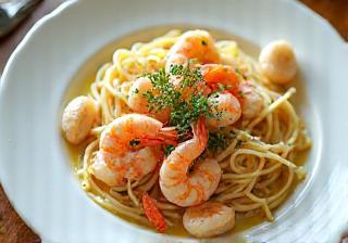 Seafood linguine with prawns, scallops, and fresh herbs in a creamy sauce